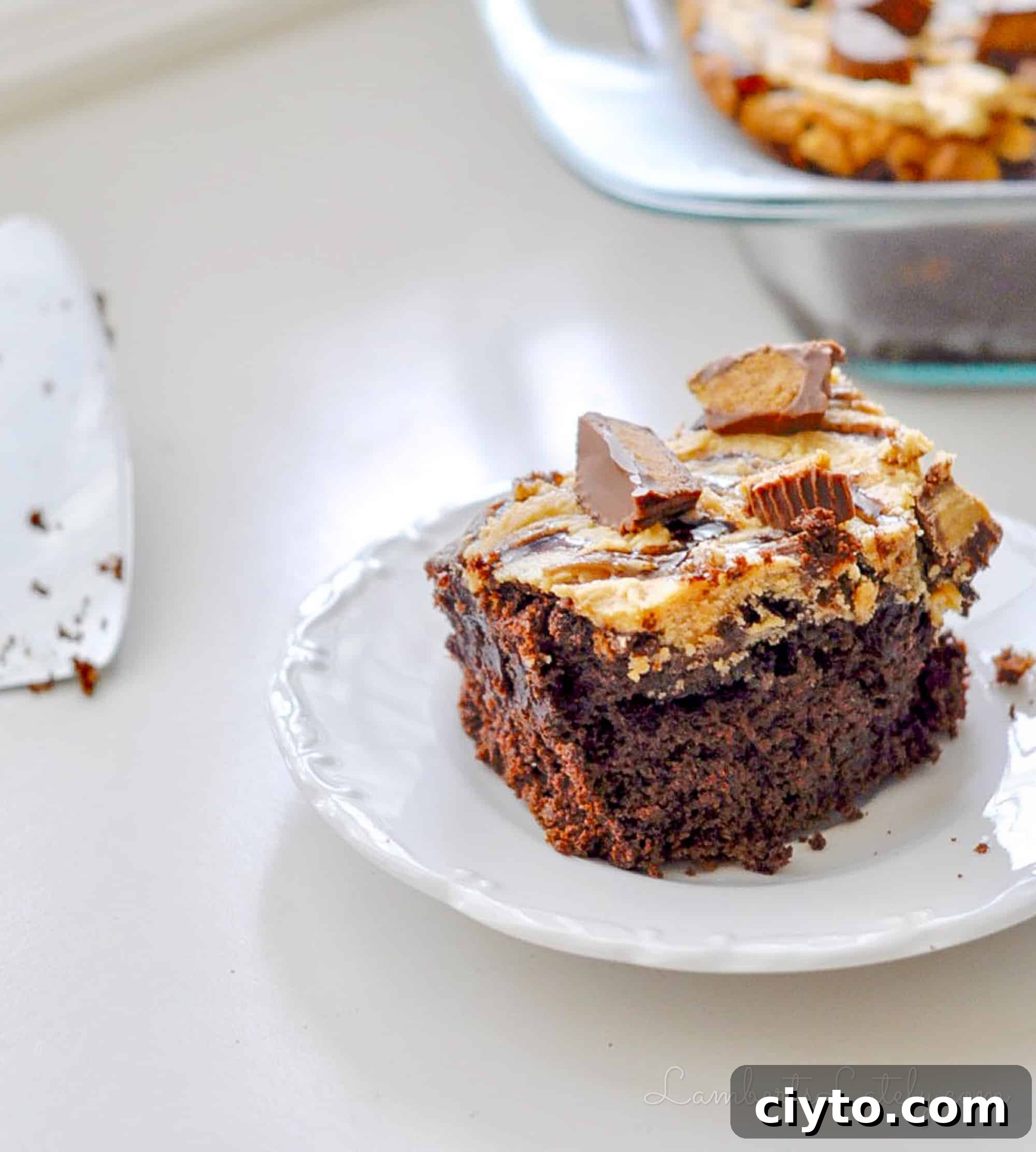 Reese's Peanut Butter Cup Cake Recipe 3 piece of reese's peanut butter cup cake on a plate.