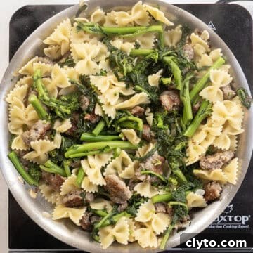 Garlicky Sausage and Broccoli Rabe Pasta 11 Farfalle added to the pan with broccoli rabe and sausage.