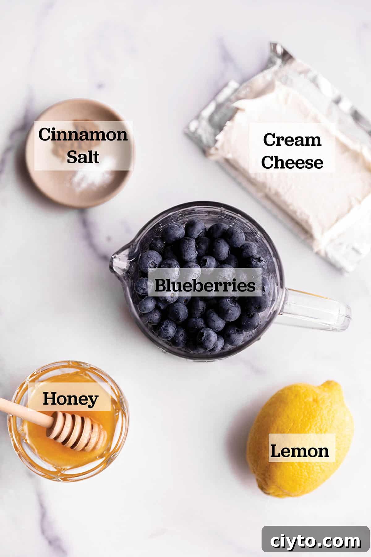 Blueberries and ingredients for blueberry cream cheese.