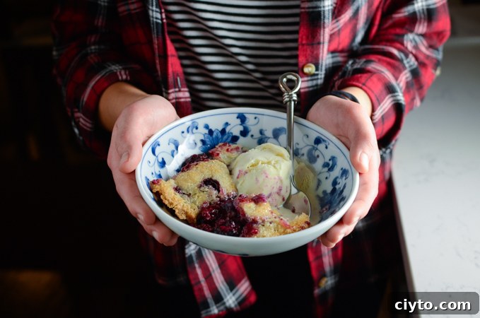 Serve warm blackberry cobbler with cold vanilla ice cream
