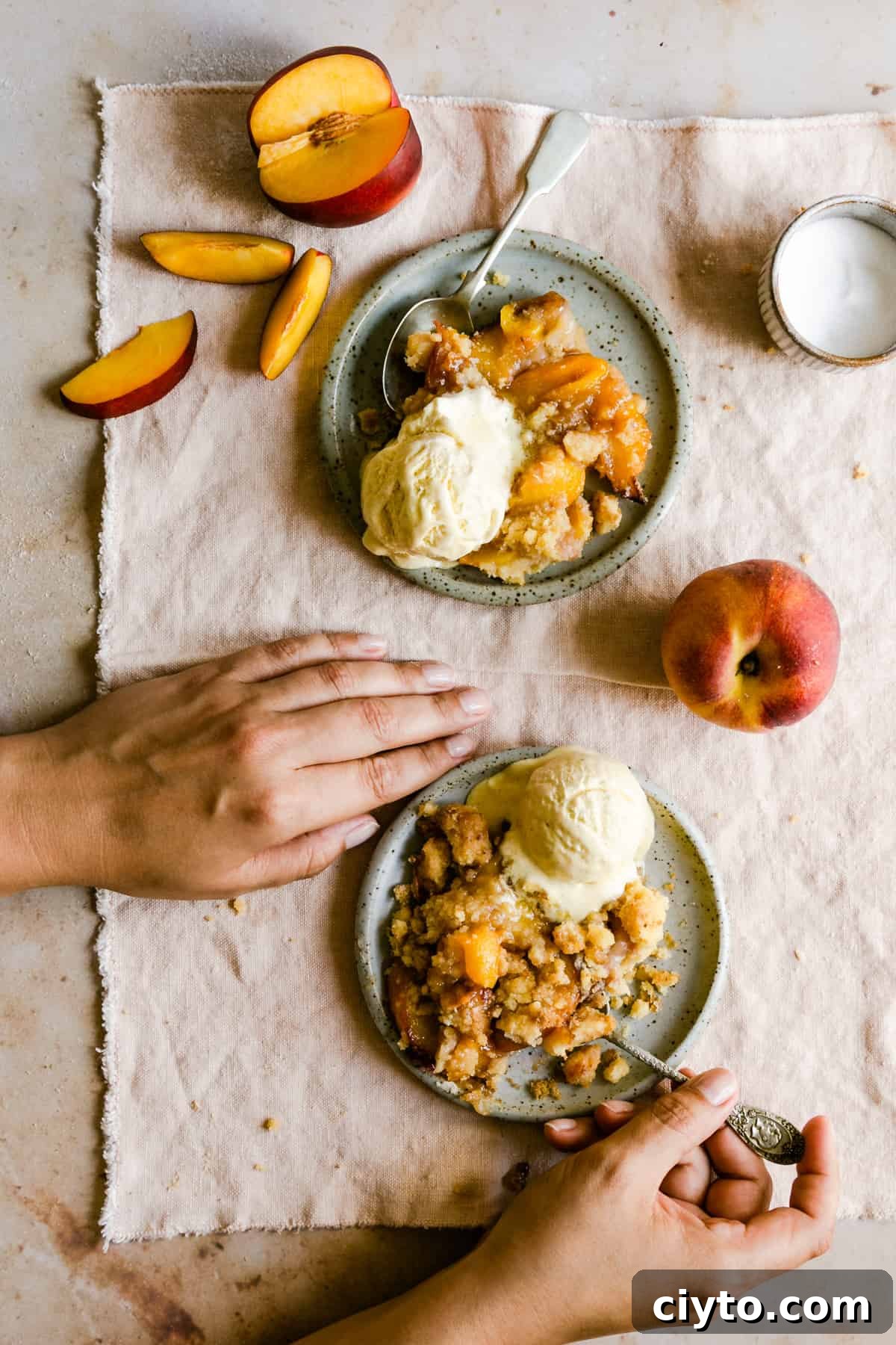 top view of a person eating peach cobbler