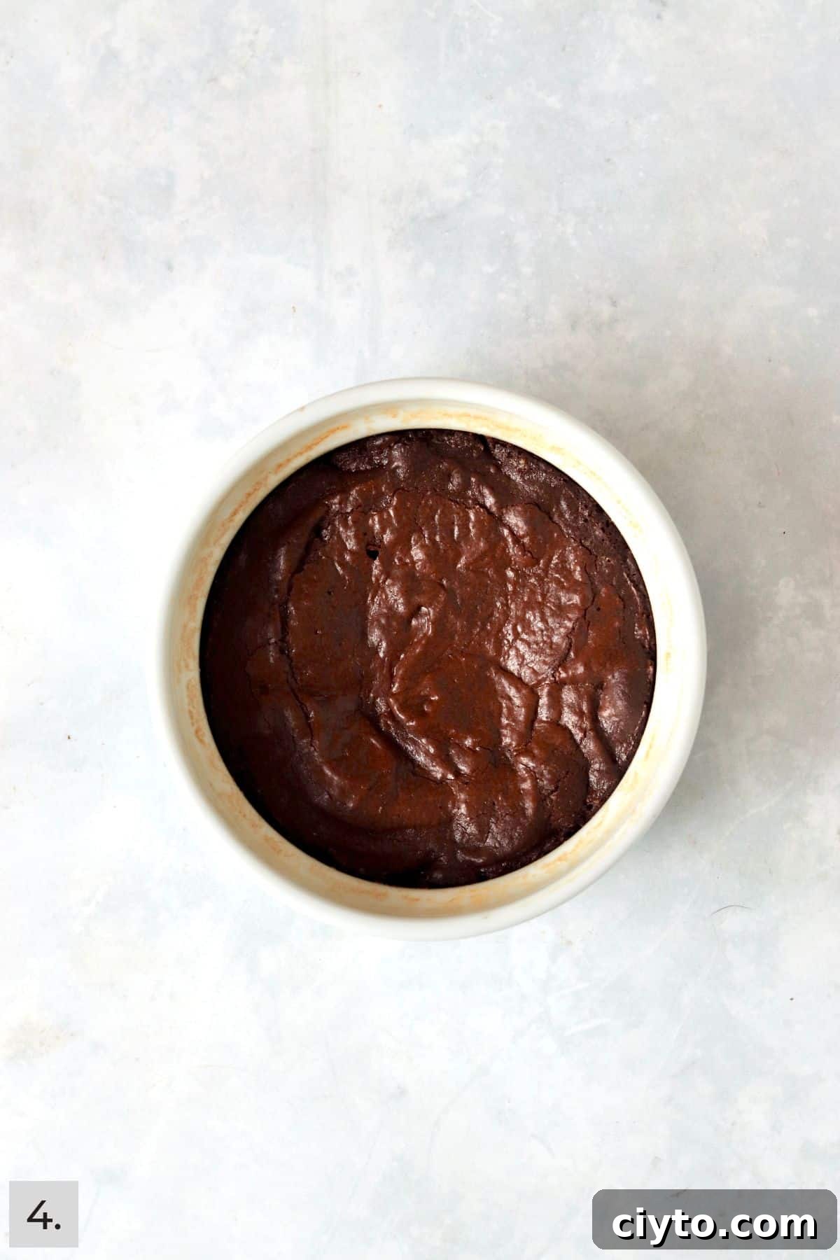 Baked single serve brownie in a ramekin.