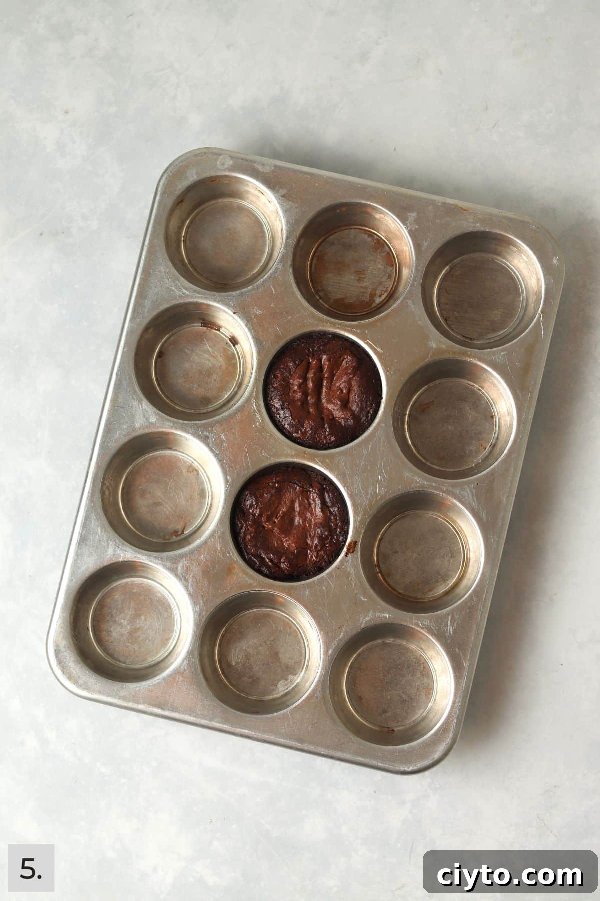 Baked single serve brownies in a muffin pan.