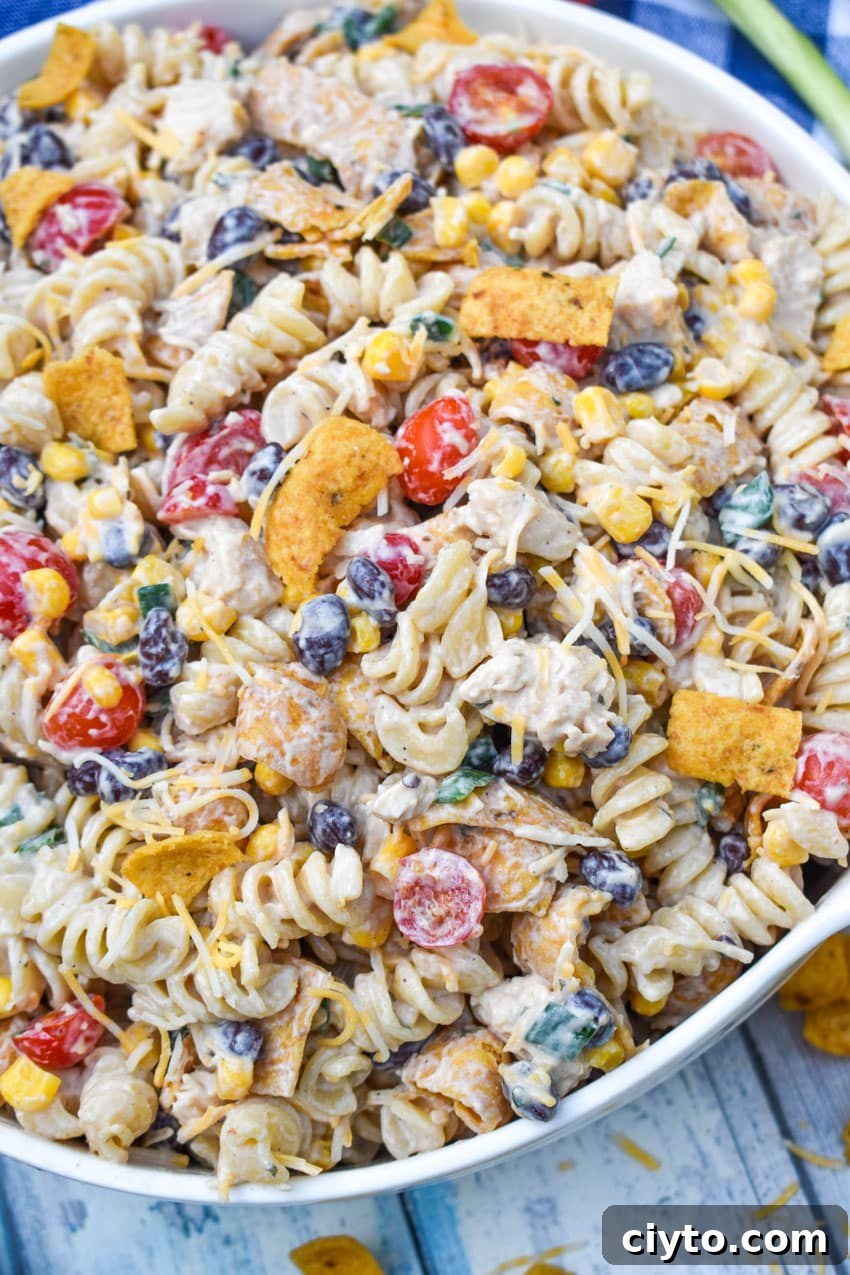 barbecue chicken pasta salad in a large white serving bowl