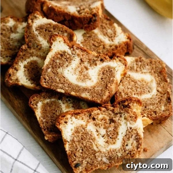 Cream Cheese Banana Bread sliced on a cutting board
