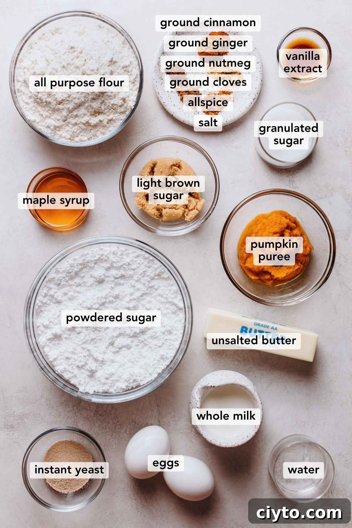 Ingredients in bowls on a white marbled background.