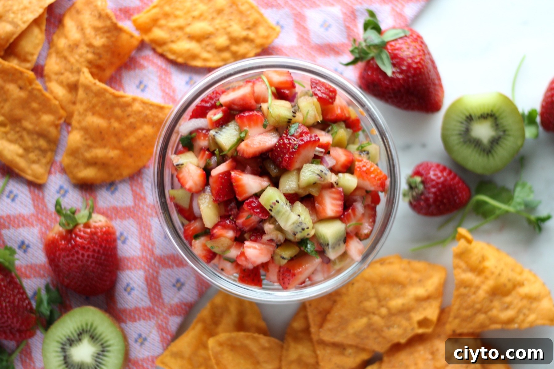 Strawberry Kiwi Fruit Salsa - a fresh, sweet salsa full of ripe fruits, cilantro, and lime! | fedandfulfilled.com