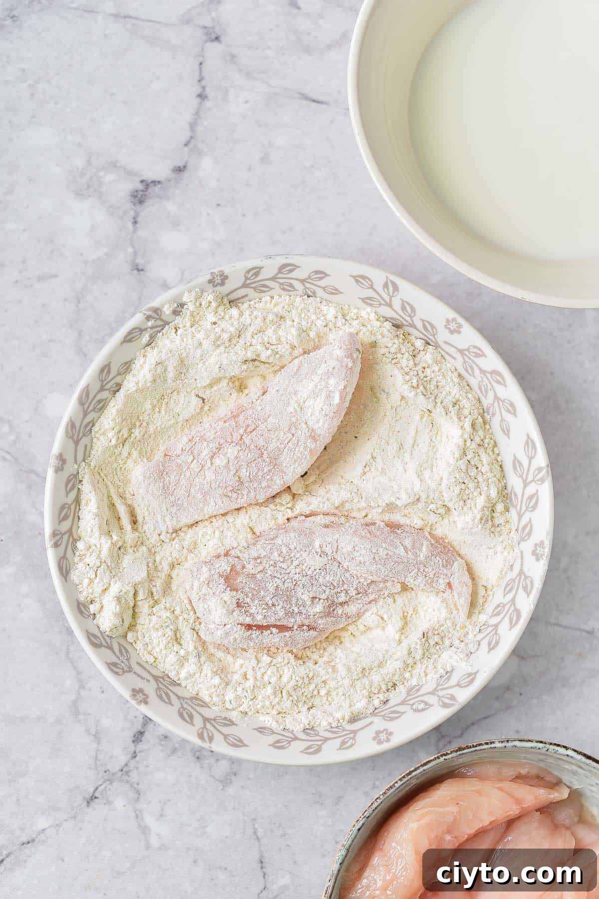 Making the fried chicken.