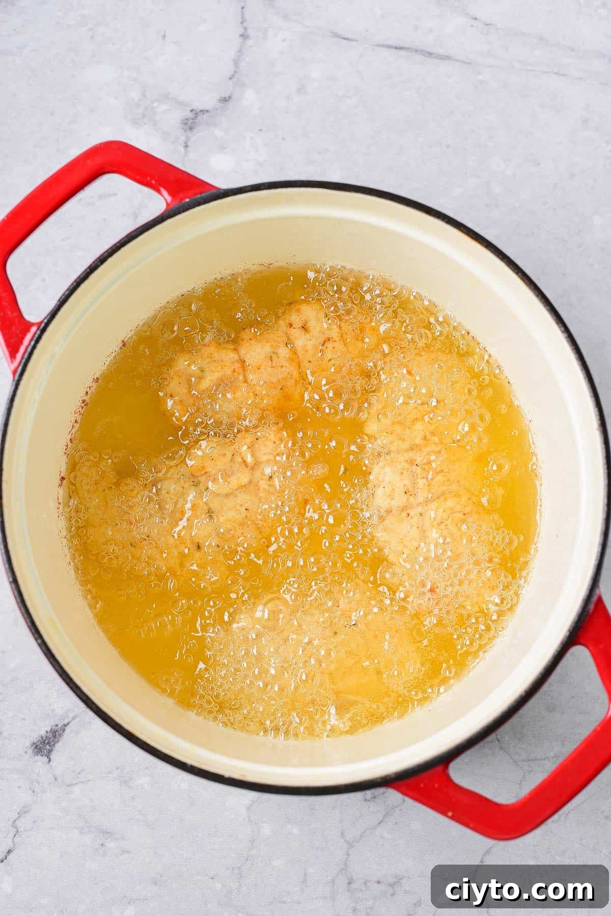 Making fried chicken.