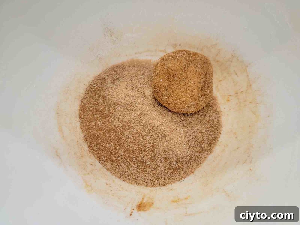 cookie dough ball in the cinnamon sugar mixture.