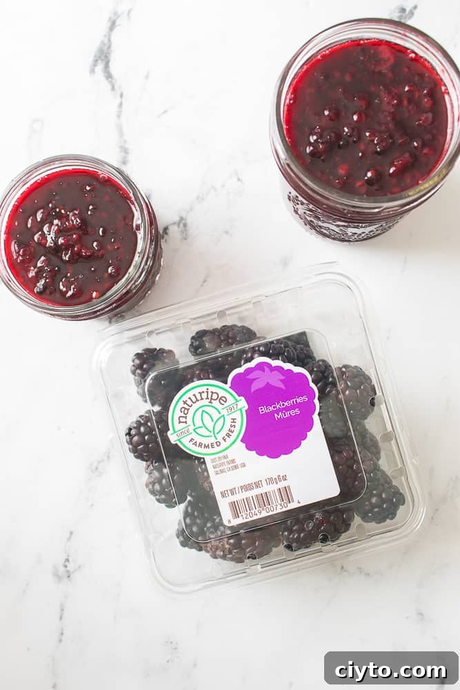overhead shot of blackberry jam in mason jars with naturipe blackberries