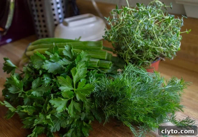fresh herbs on a wooden cutting board.