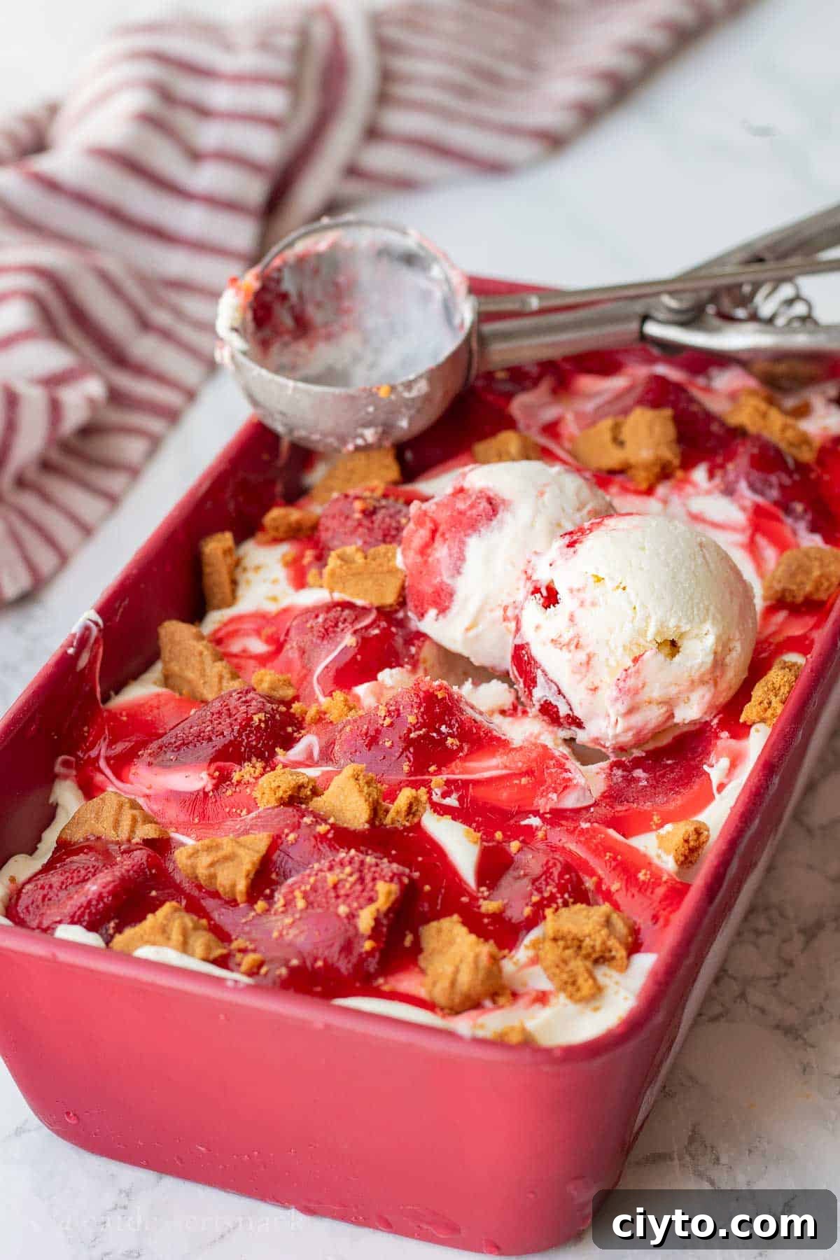 Scoops of cheesecake ice cream in a pan.
