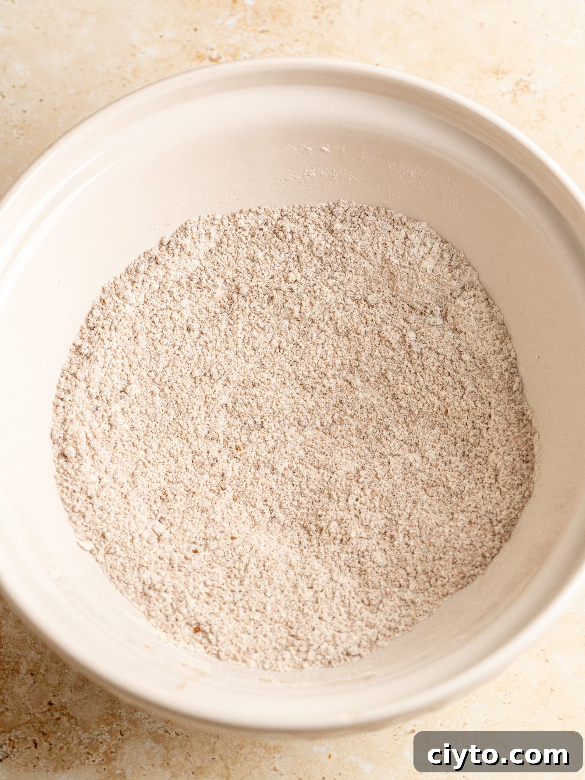 Mixing dry ingredients for pumpkin muffins