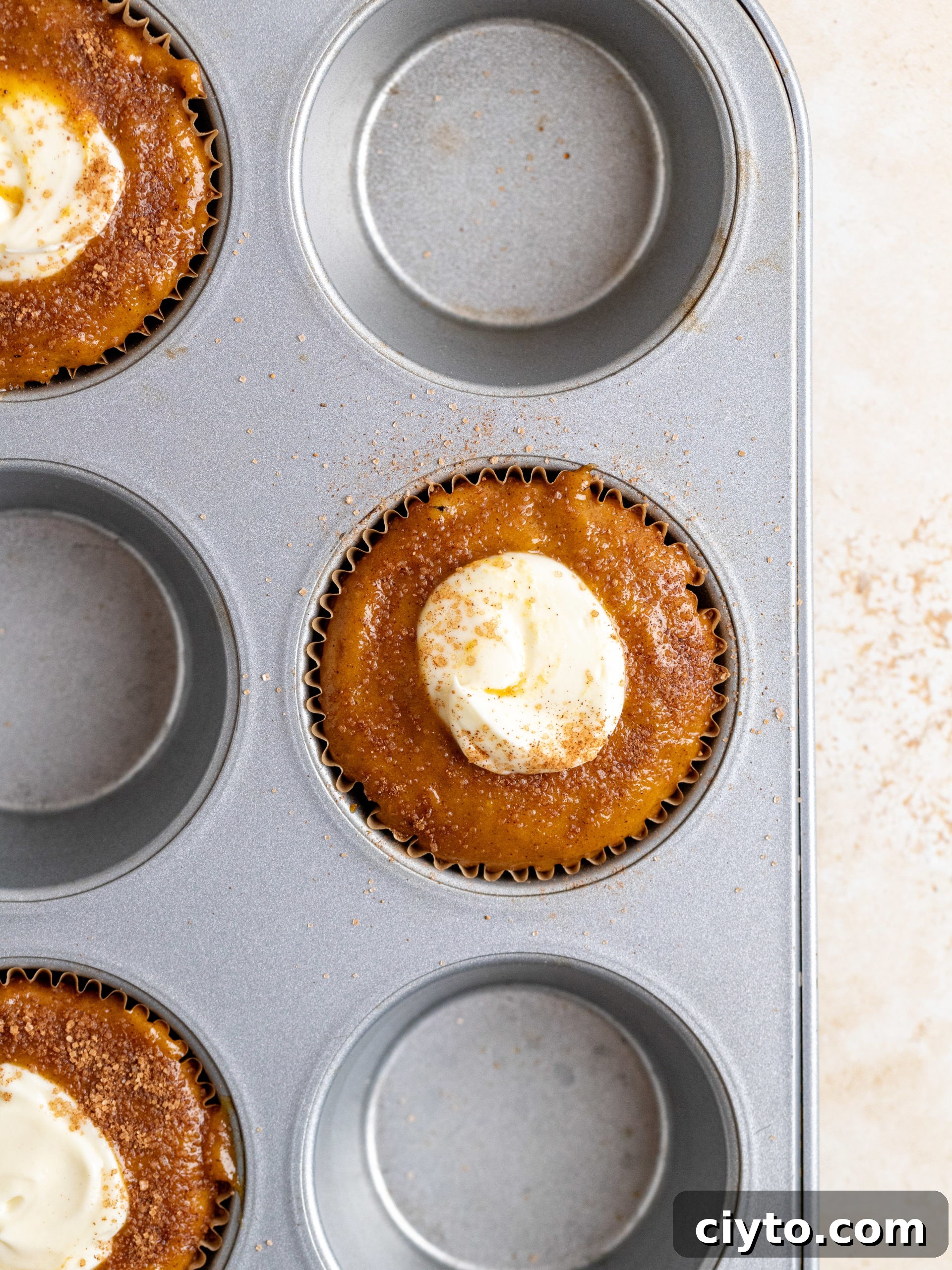 Baked pumpkin cream cheese muffins