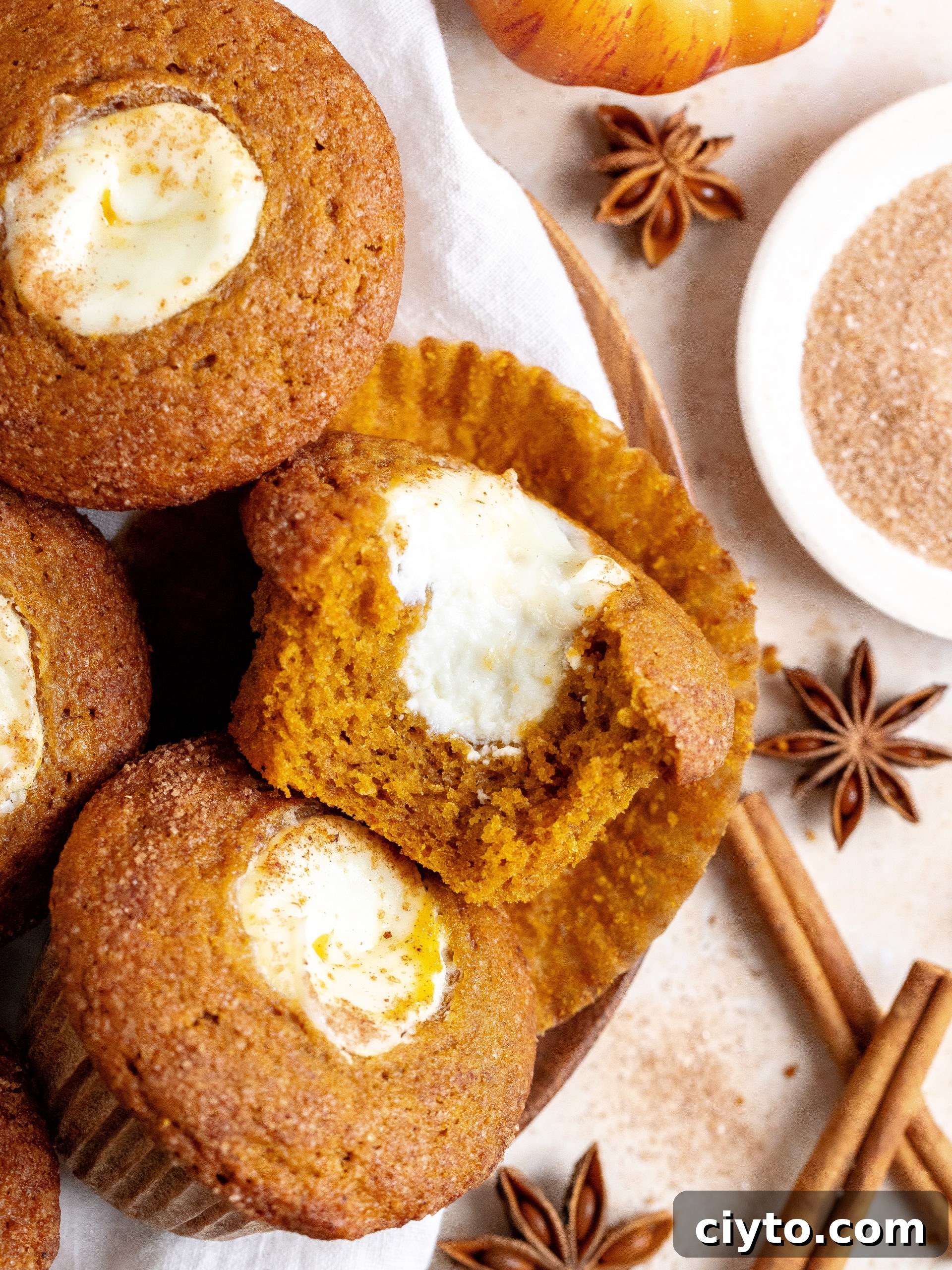 Bakery style pumpkin cream cheese muffins