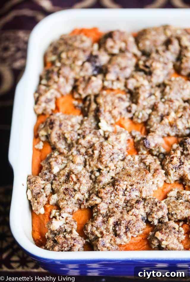 Sweet Potato Casserole with Praline Topping - this is a really special sweet potato casserole for Thanksgiving and the holiday season. Roasted sweet potatoes and sweet spices add lots of flavor and the praline topping is amazing!