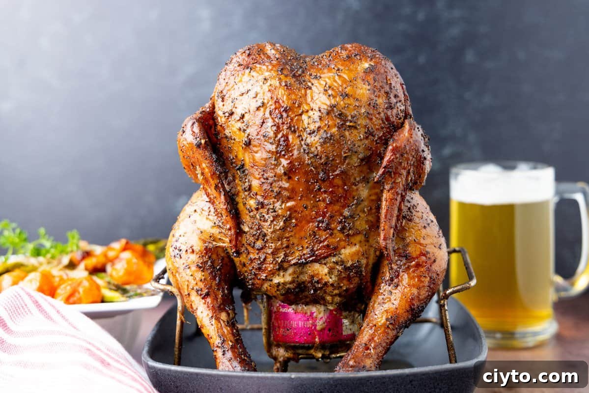 How to Smoke Beer Can Chicken 12 Chicken on beer can with beer in backround.