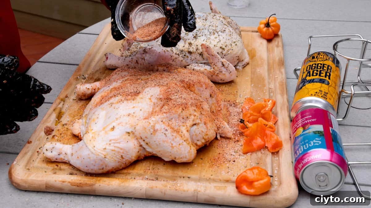 How to Smoke Beer Can Chicken 5 Chickens on cutting board being seasoned with habaneros and beer cans in background.