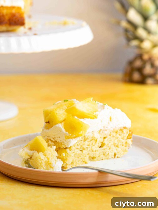 a slice of pina colada cake