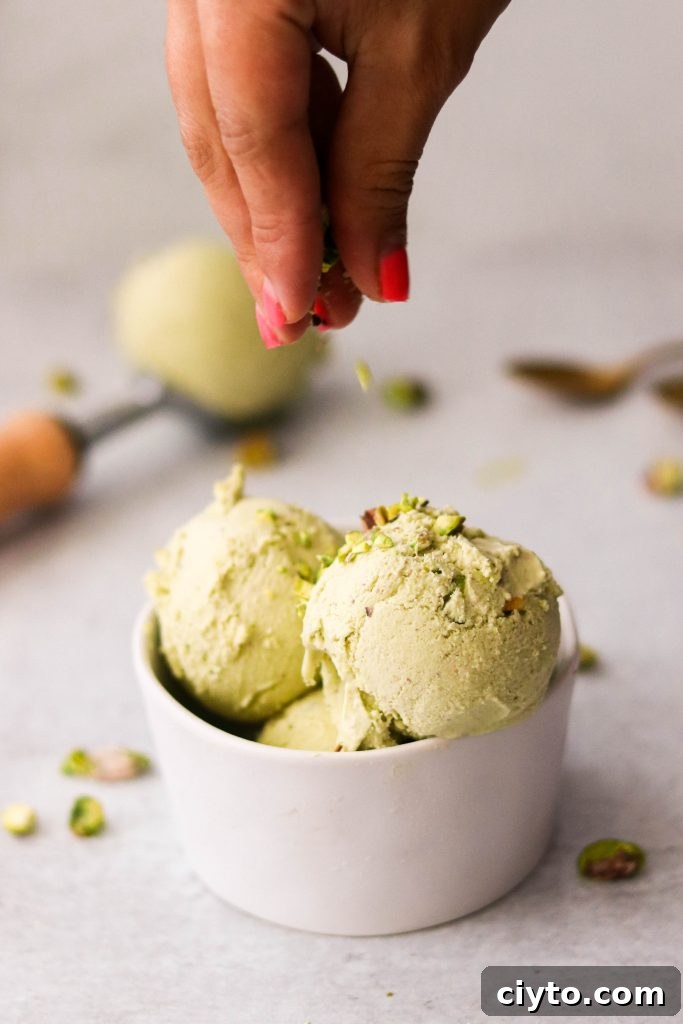 Homemade pistachio ice cream sprinkled with chopped pistachios