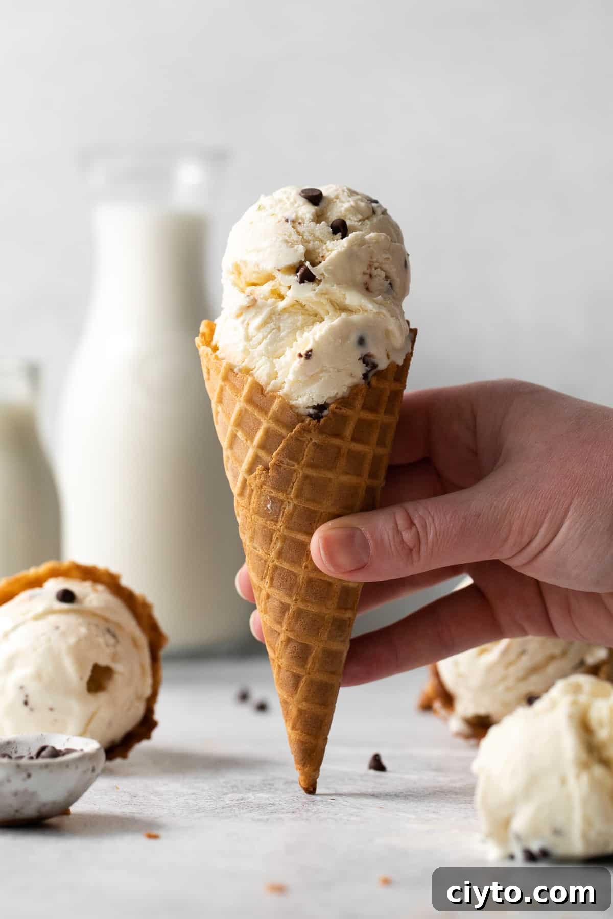 Cannoli Ice Cream Recipe with Ricotta and Chocolate Chips 2 Creamy cannoli ice cream scooped in a cone.