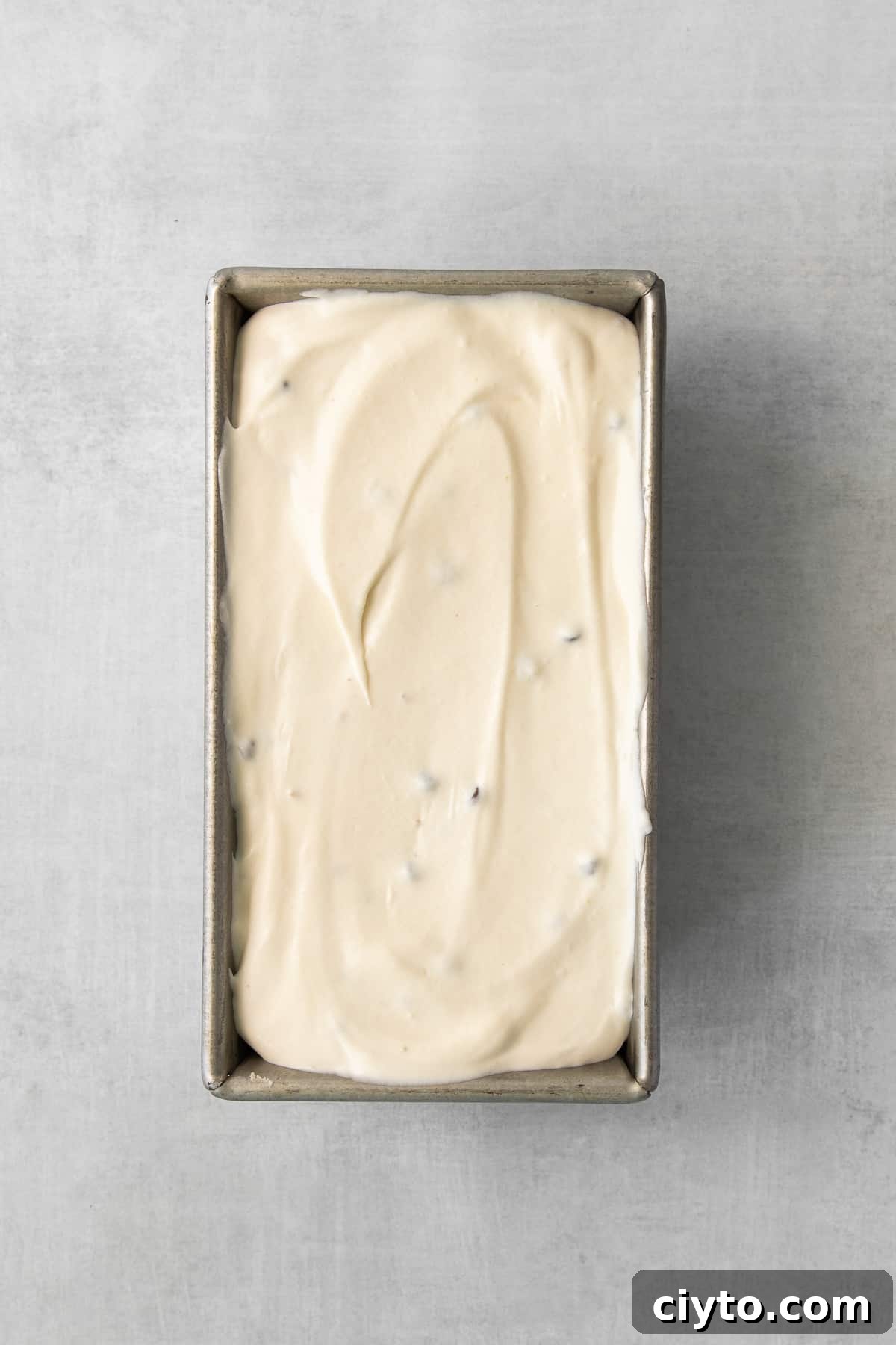 Cannoli Ice Cream Recipe with Ricotta and Chocolate Chips 5 Homemade cannoli ice cream set in a loaf pan, ready to scoop.