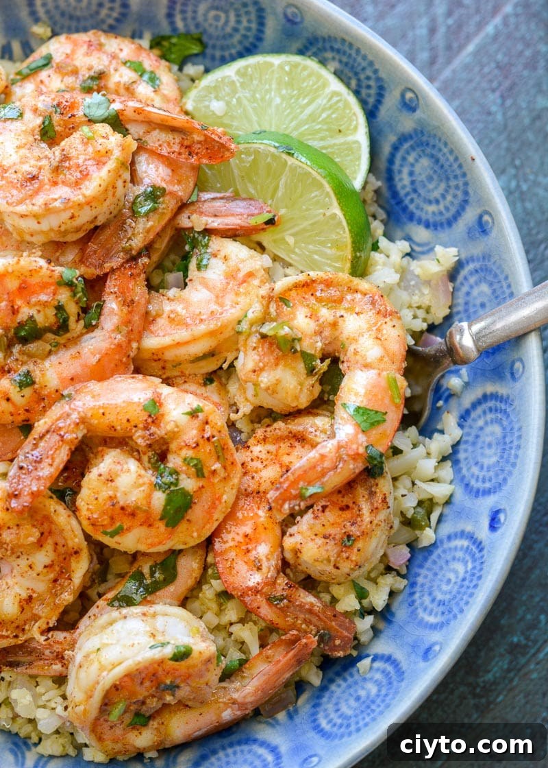 This Cilantro Lime Shrimp and Cauliflower Rice is low calorie, low carb, keto-friendly and packed with flavor! This is a 20 minute meal your entire family will love!
