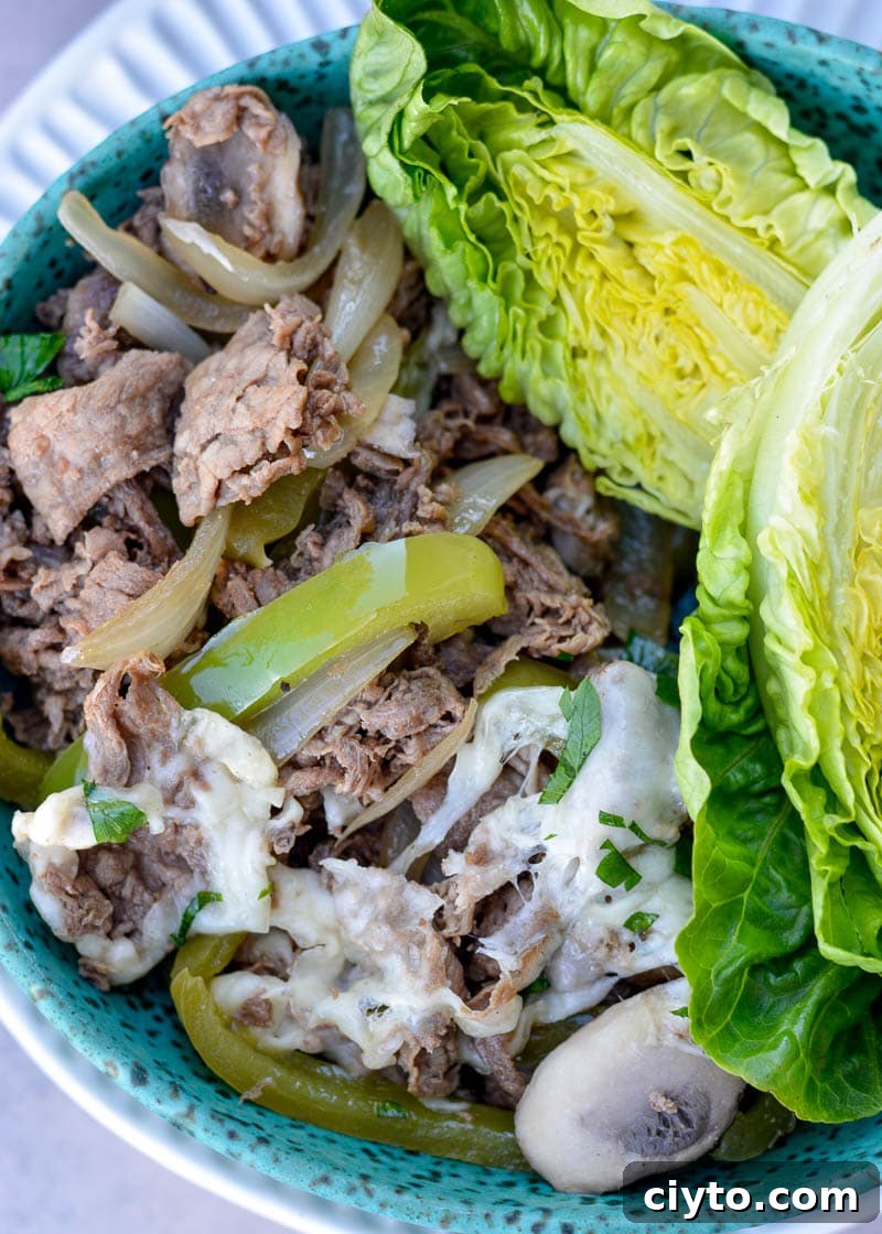 These one-pan Philly Cheesesteak Lettuce Wraps are the perfect meal prep lunch or dinner! Filled with sizzling beef, veggies, and cheese, this quick low-carb meal has less than 4 net carbs!
