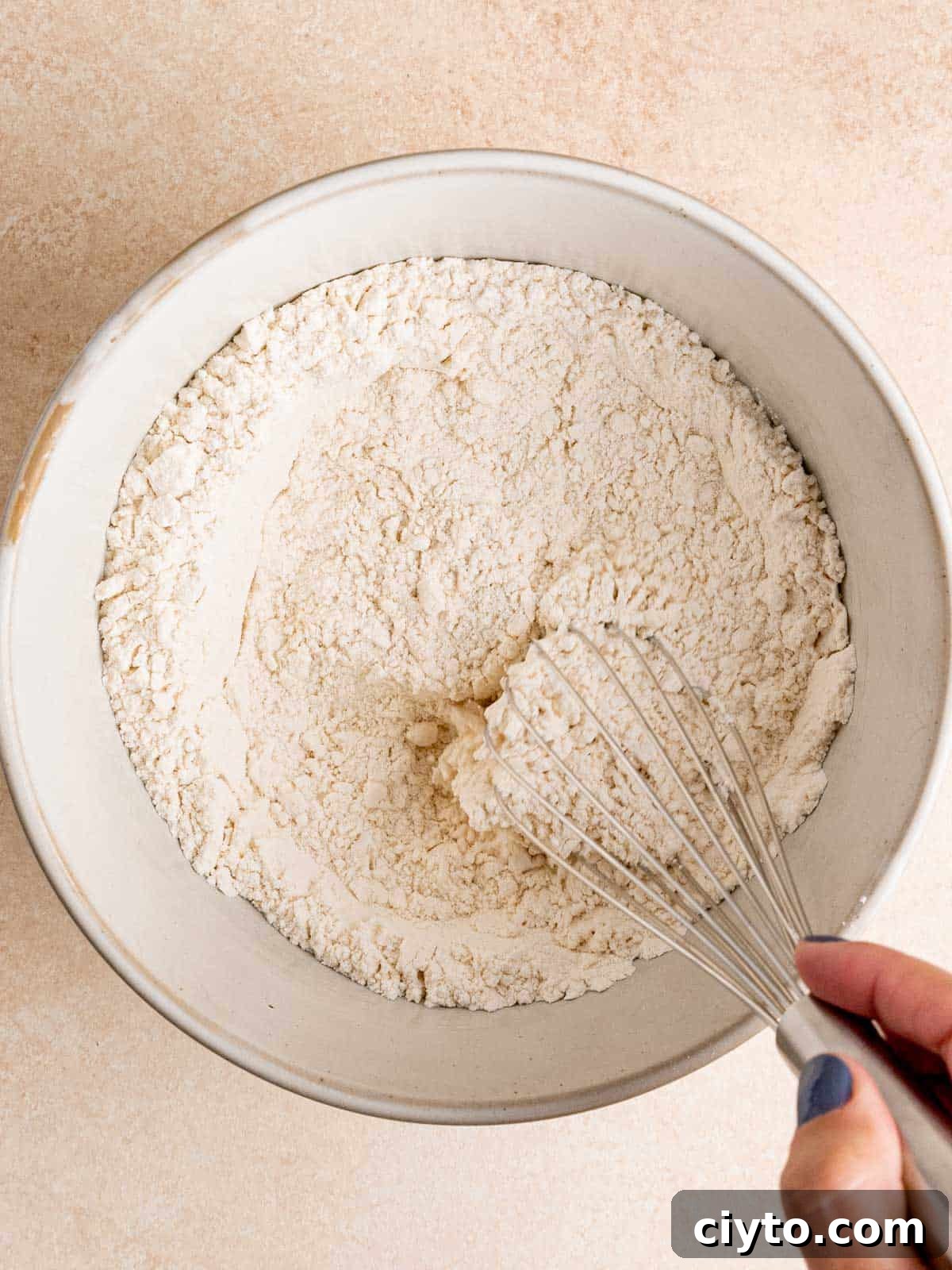 Whisking flour, cornstarch, baking powder and salt in a bowl.