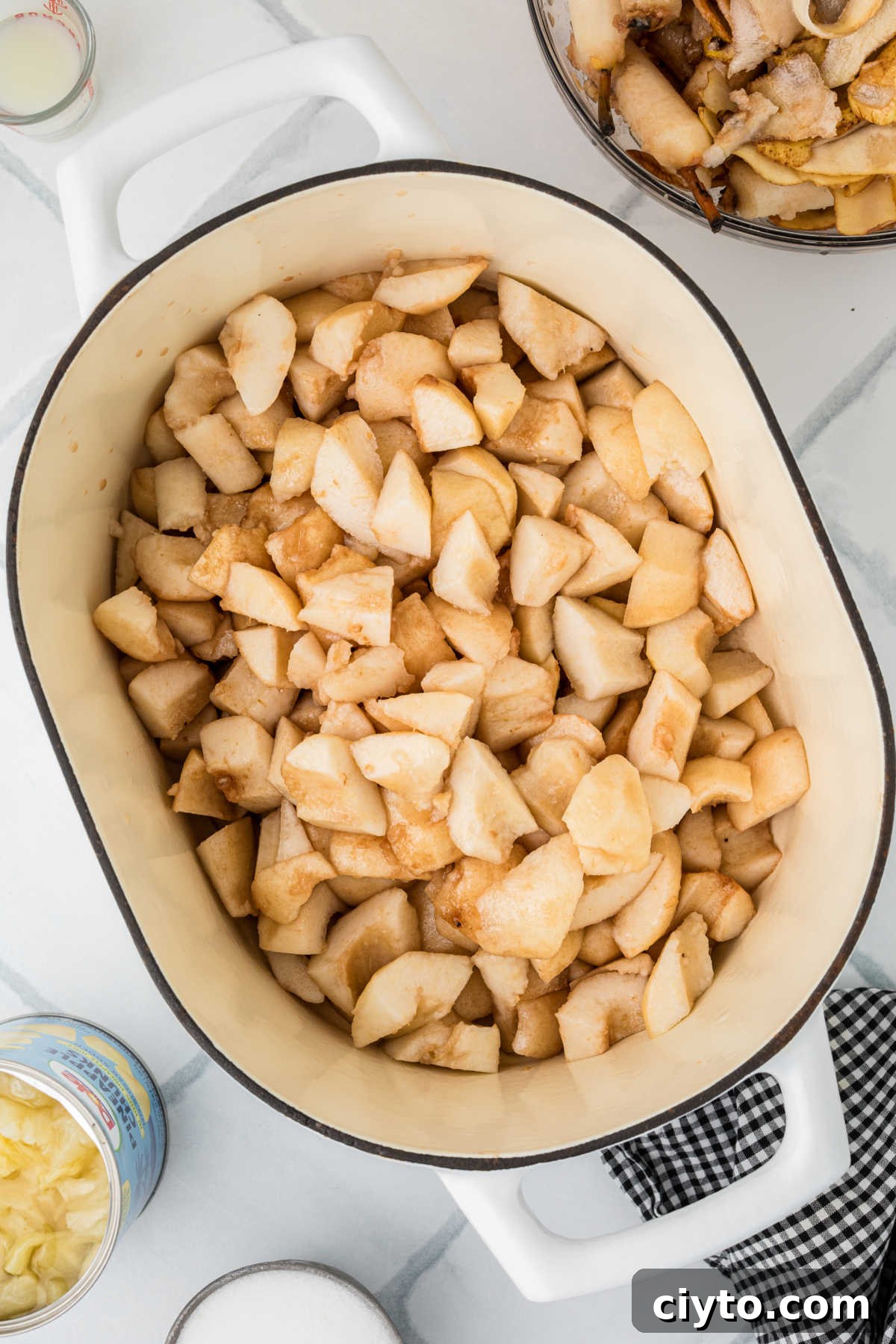 A large pot filled with pieces of pear.