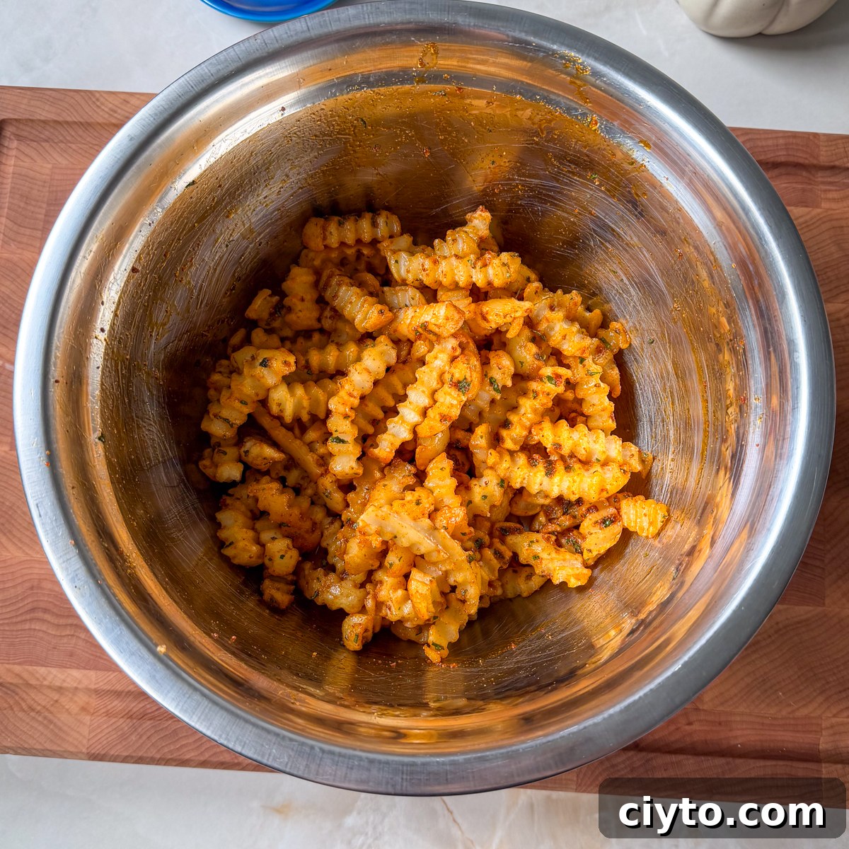 Toss the fries until fully coated