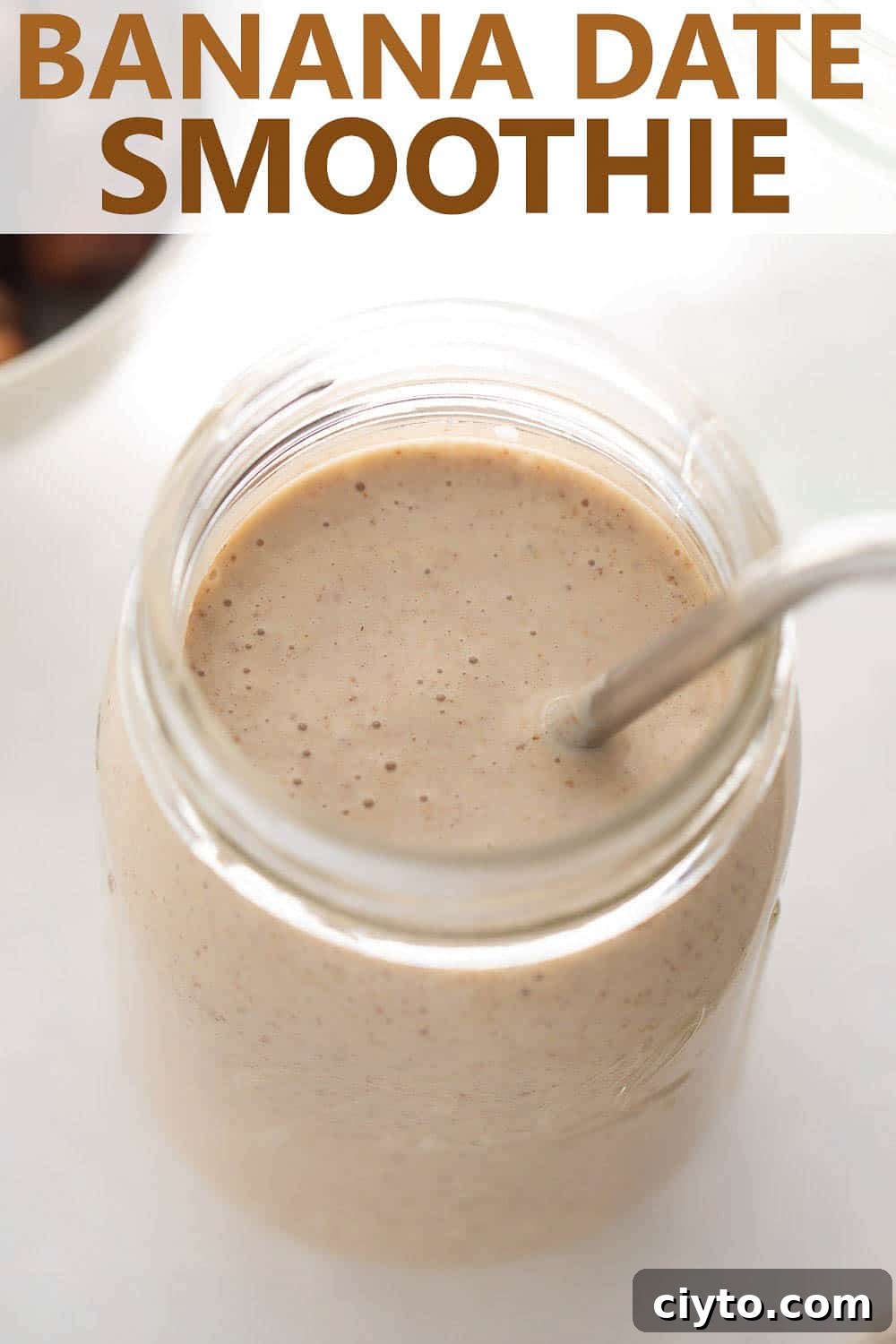 close up shot of banana smoothie in cup