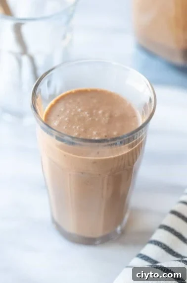 glass of chocolate banana smoothie with avocado