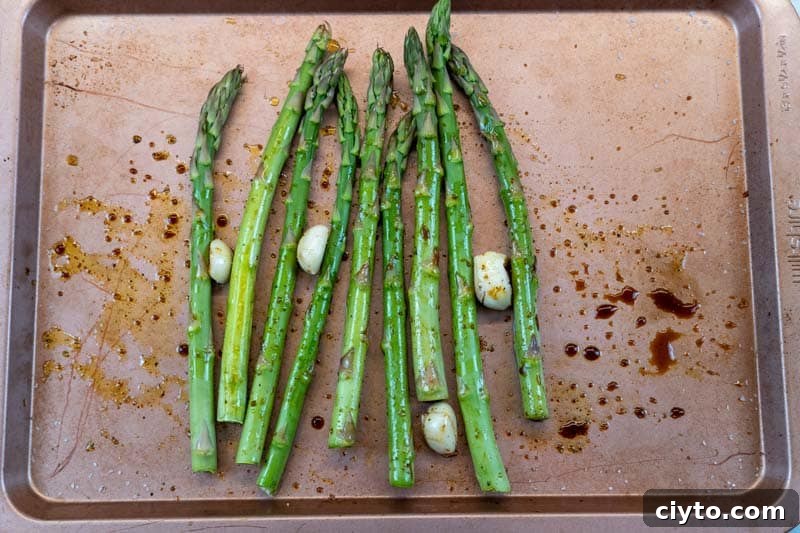 Oven-Roasted Asparagus with Balsamic Glaze 4 Adding the balsamic vinegar to the asparagus and garlic