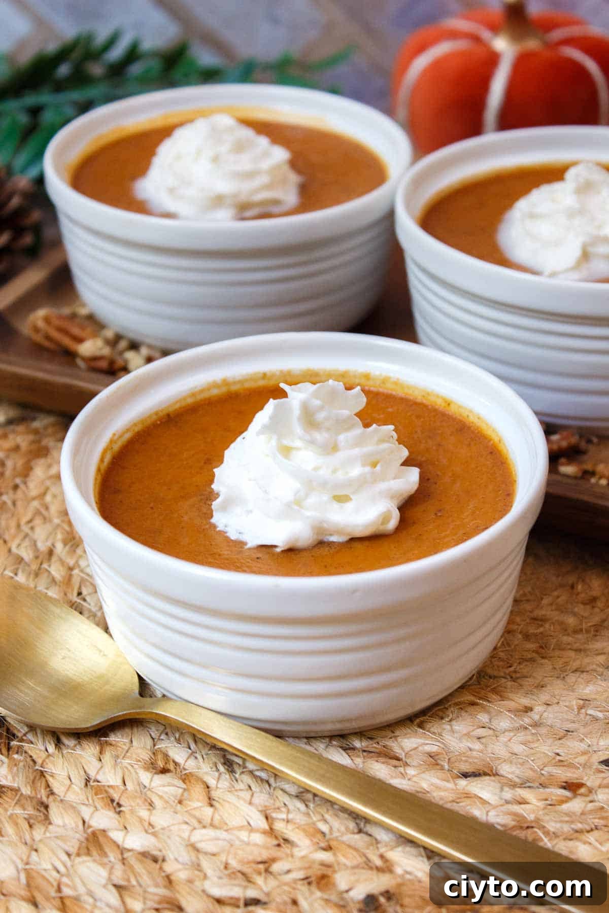 Baked pumpkin custard with whipped cream.