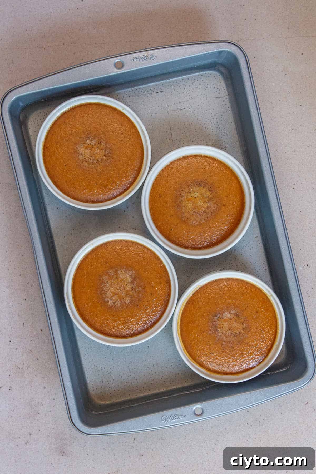 Pumpkin custard slightly browned after baking.