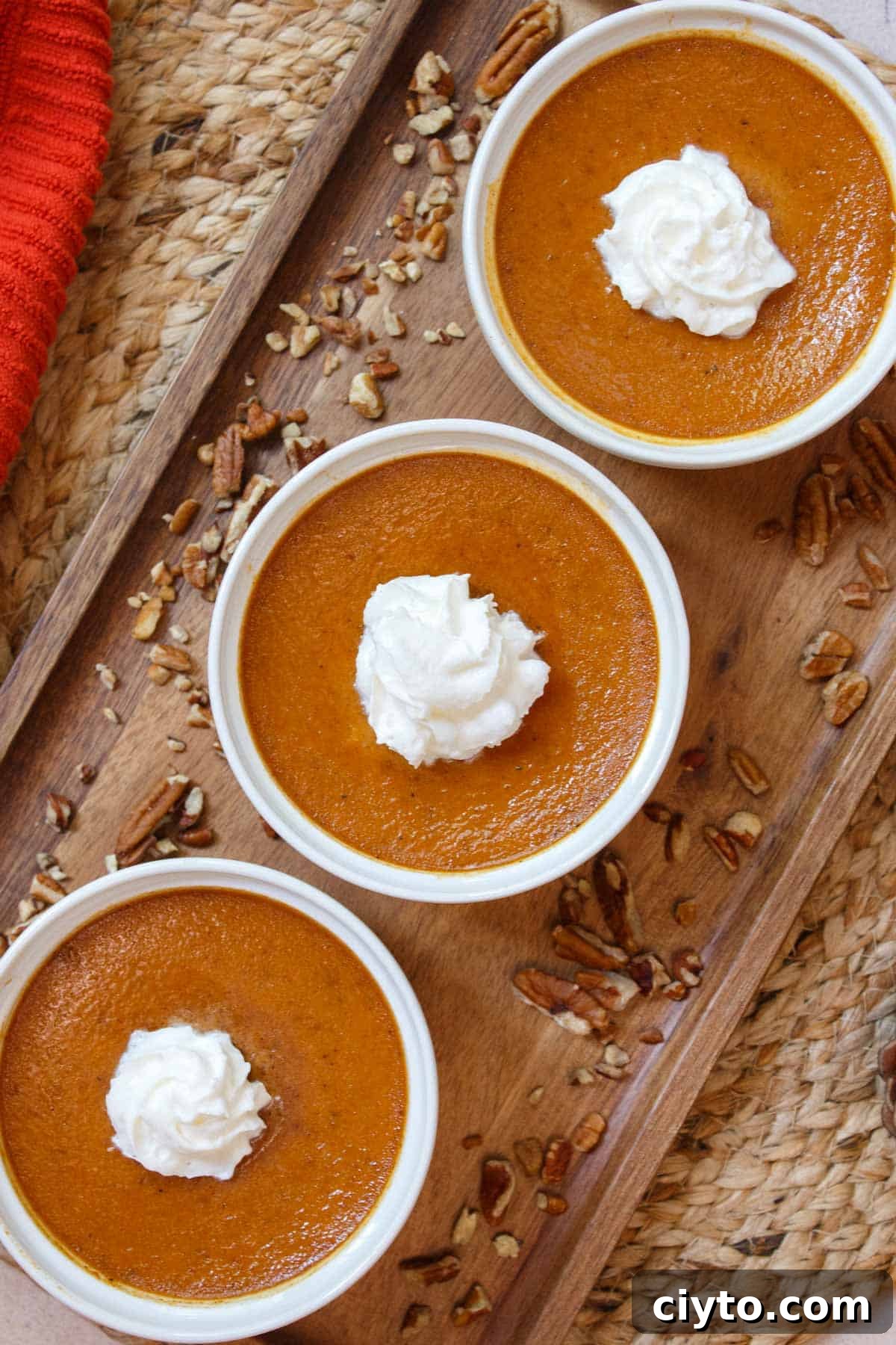 Baked pumpkin custard with whipped cream.
