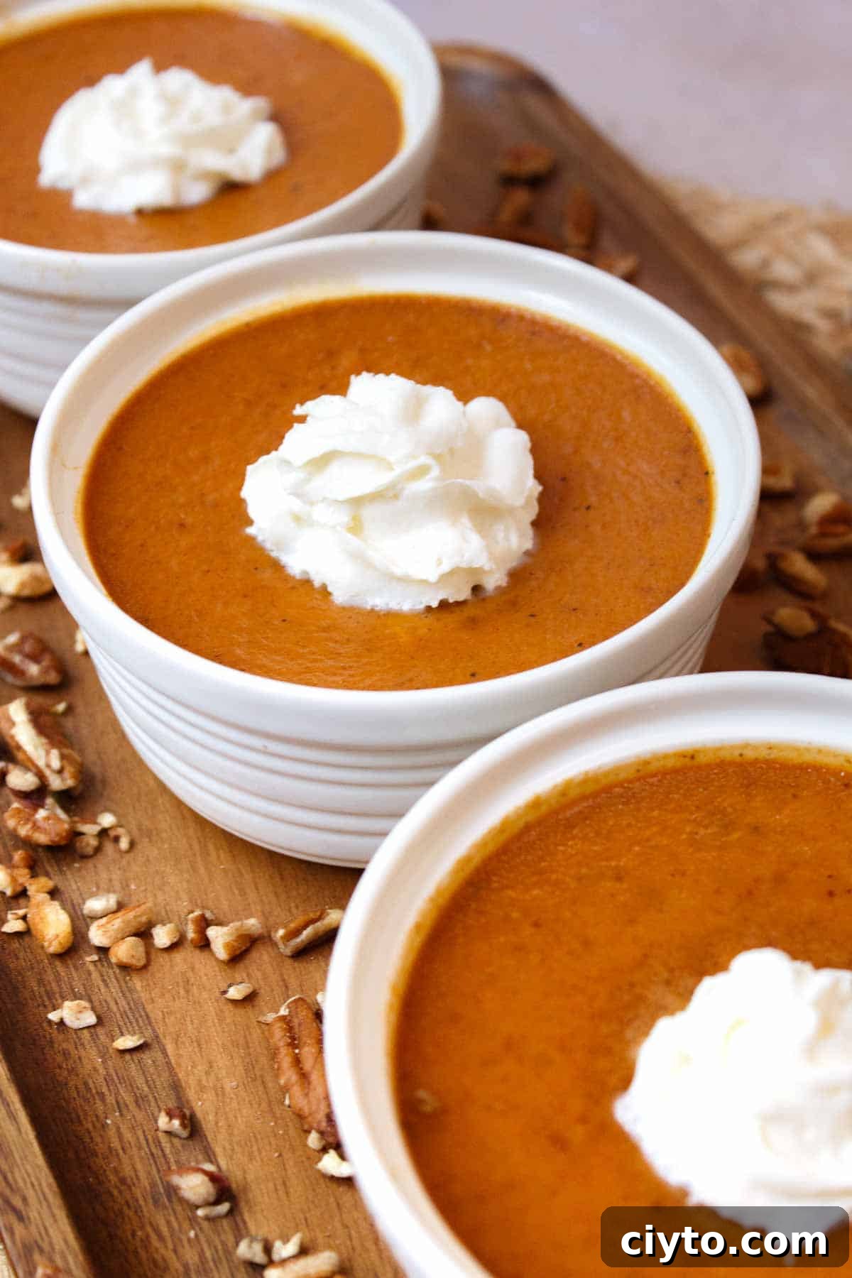 Baked pumpkin custard with whipped cream.