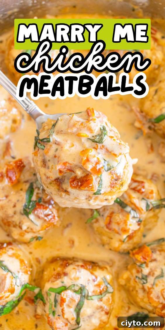 A spoon lifts a chicken meatball from a luscious, creamy sauce, garnished with fresh herbs. Text overlay reads 