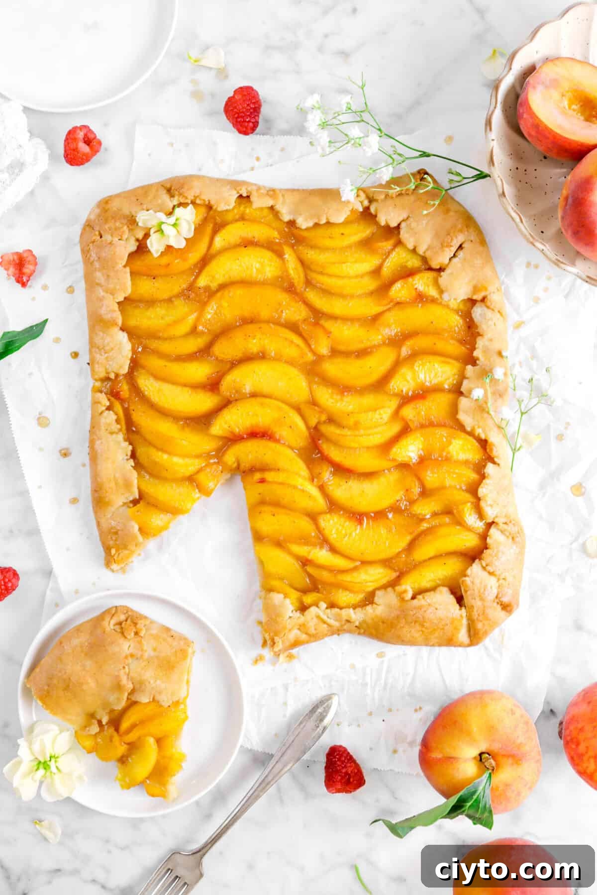overhead shot of galette on parchment paper with slice on white plate