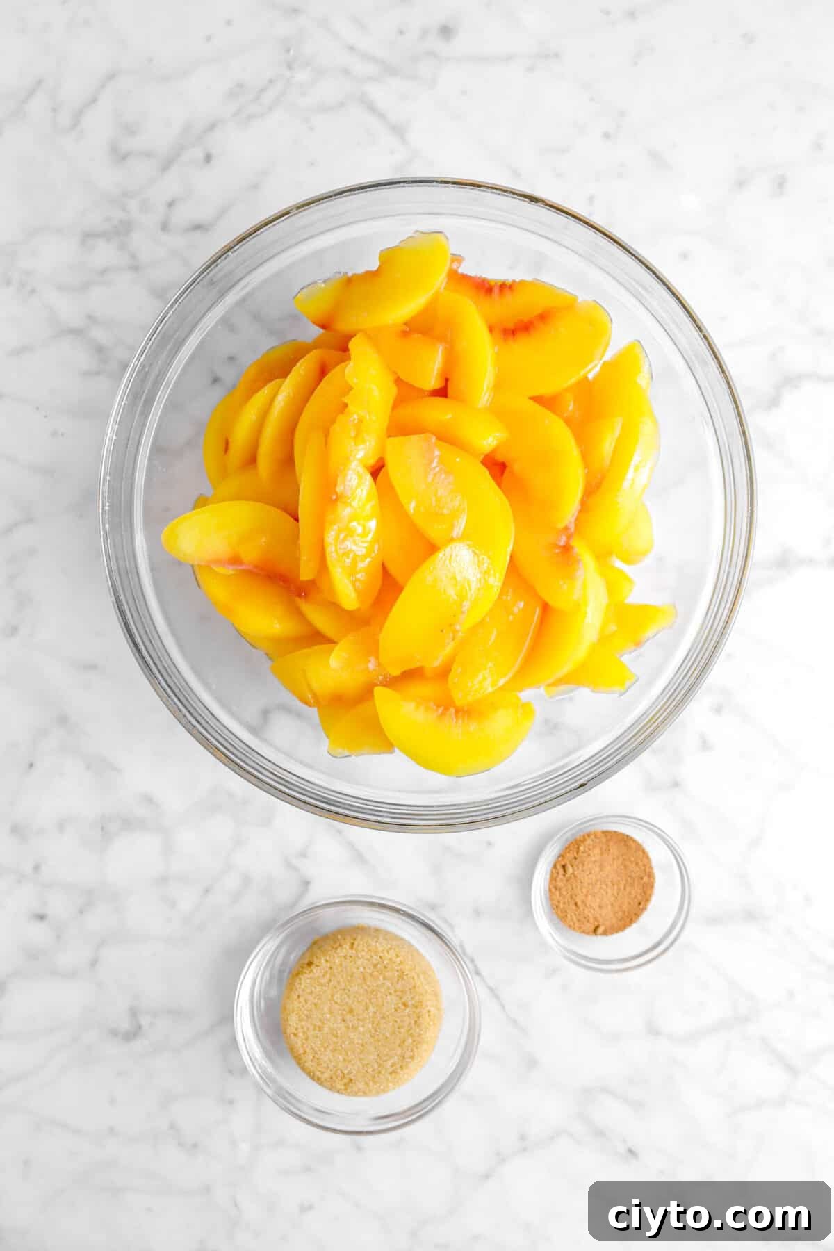 peach slices, nutmeg, and brown sugar in glass bowls