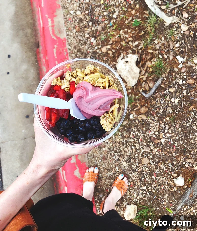 holding an acai bowl at costco