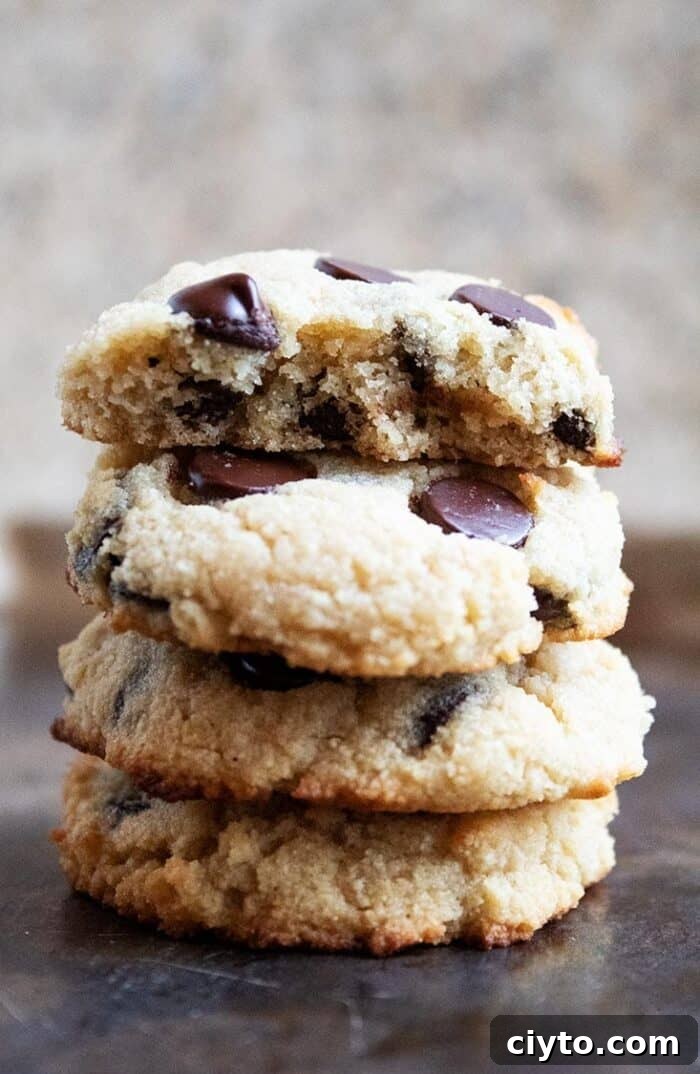 Low-Carb Peanut Butter Crunch Bars, Gluten Free, No Added Sugar 12 stack of three keto chocolate chip cookies on a baking sheet