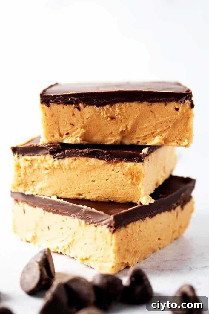 Low-Carb Peanut Butter Crunch Bars, Gluten Free, No Added Sugar 14 side view of three pieces of keto no bake peanut butter bars with chocolate chips scattered in front