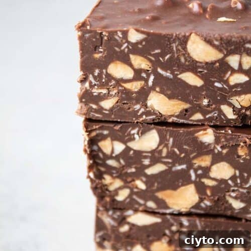 sideview of stack of three homemade cruch bars that are low carb, sugar free, gluten free, keto and healthy on a white background