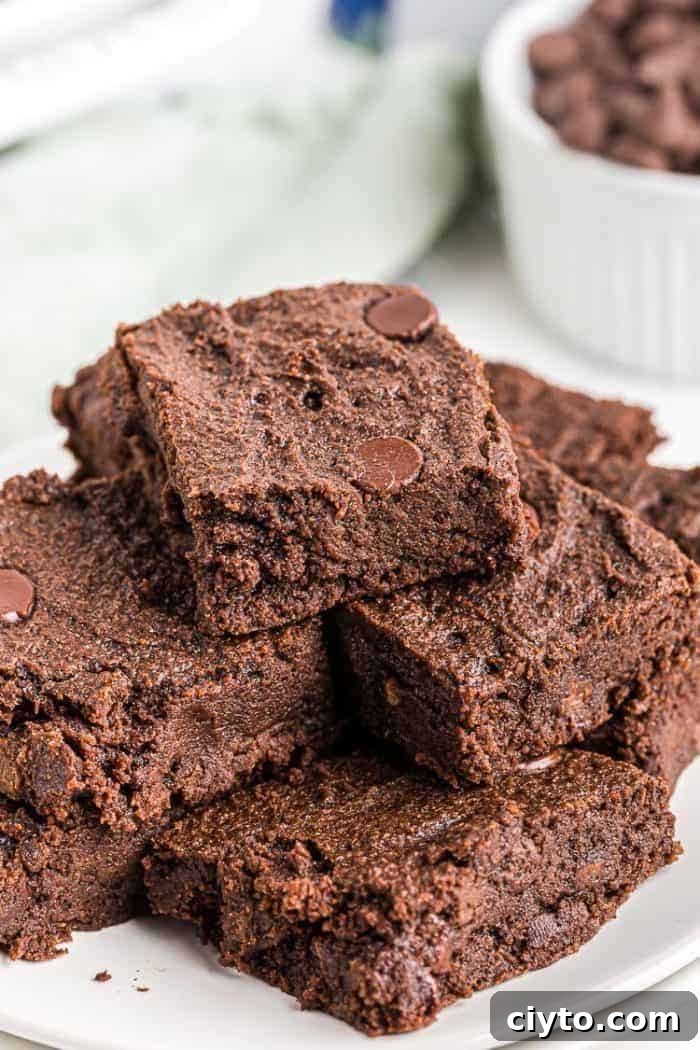 Low-Carb Peanut Butter Crunch Bars, Gluten Free, No Added Sugar 7 closeup of stacked keto chocolate cookies on a white plate