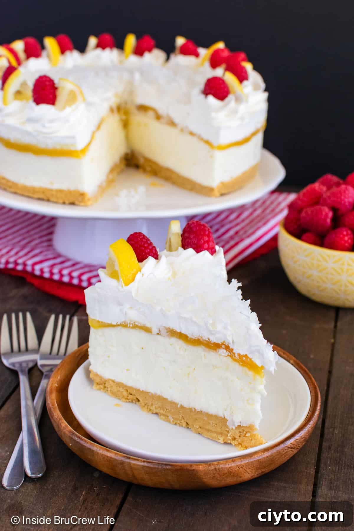 No-Bake Lemon Coconut Cheesecake Recipe 5 A slice of no bake lemon coconut cheesecake on a plate with the rest behind it.