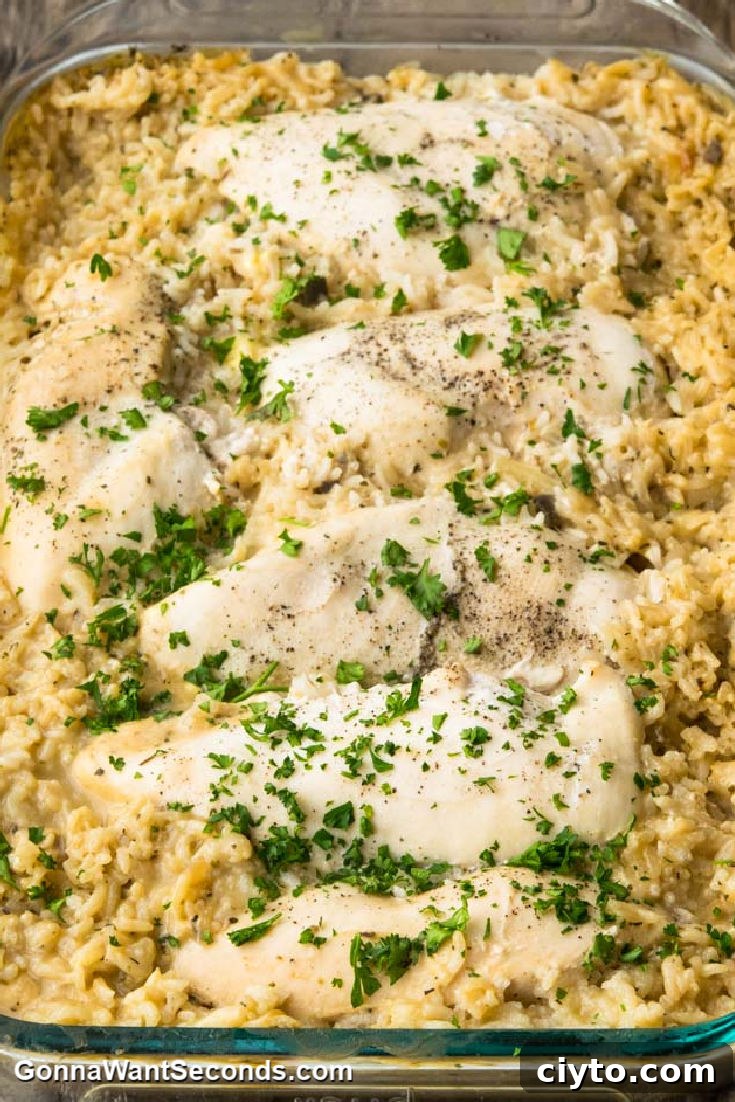 No Peek Chicken on top of rice, in a casserole dish