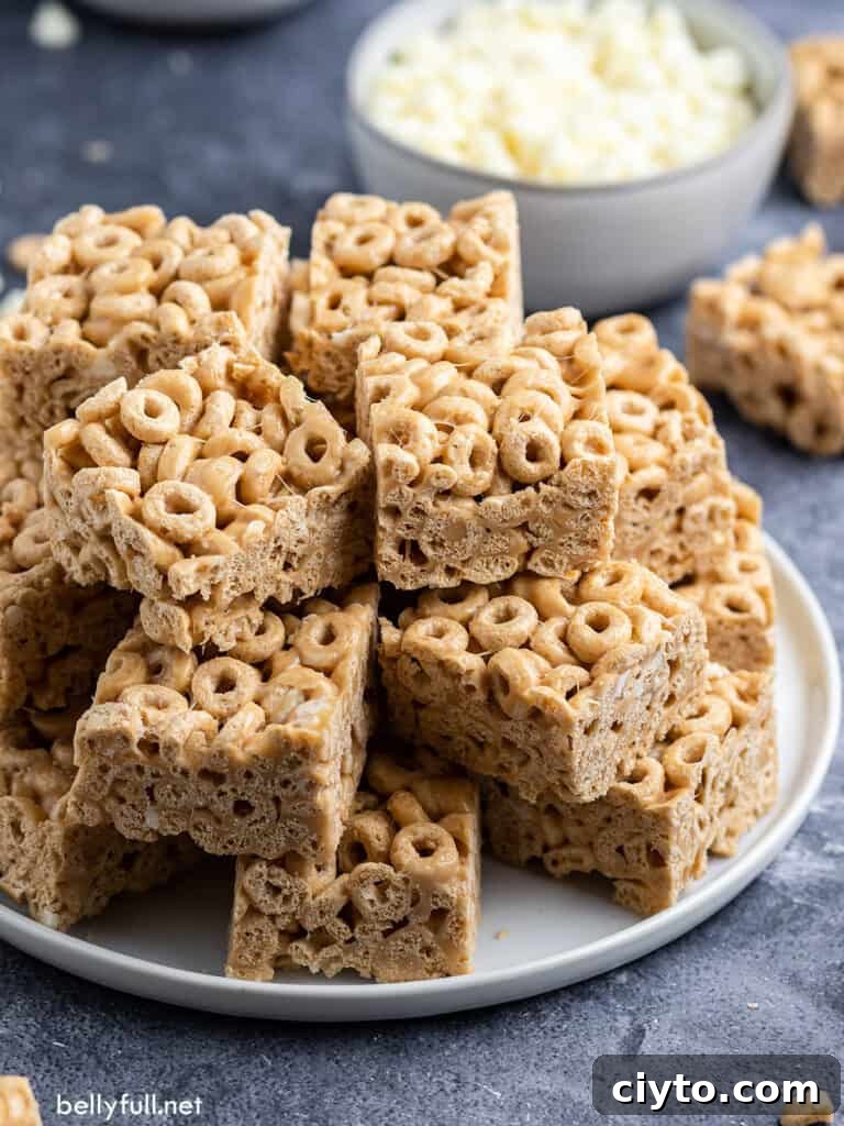 stack of cheerios marshmallow treats on white plate